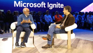 Adobe CEO Shantanu Narayen (L) and Judson Althoff, CEO of Microsoft's commercial business