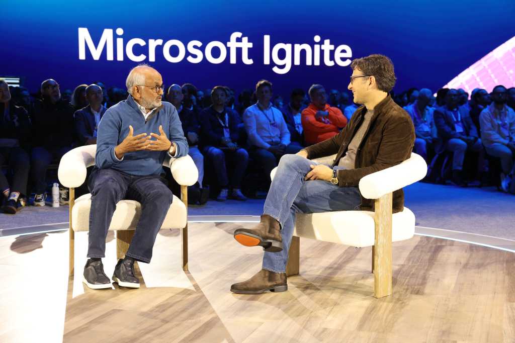 Adobe CEO Shantanu Narayen (L) and Judson Althoff, CEO of Microsoft's commercial business