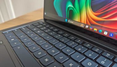 Lenovo Yoga Slim 7x keyboard and display closeup with Windows 11 taskbar