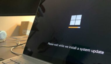 Windows 11 system update message on a laptop screen