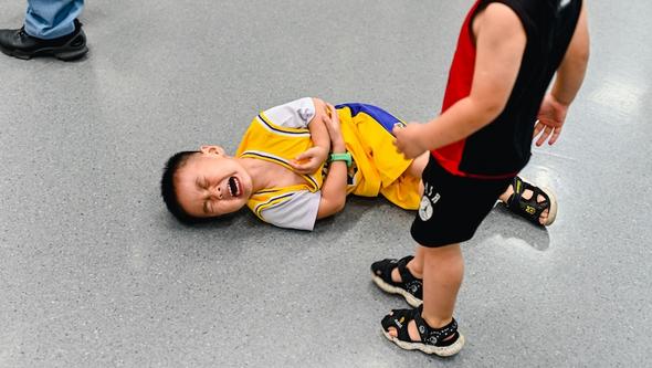Child in pain on the floor