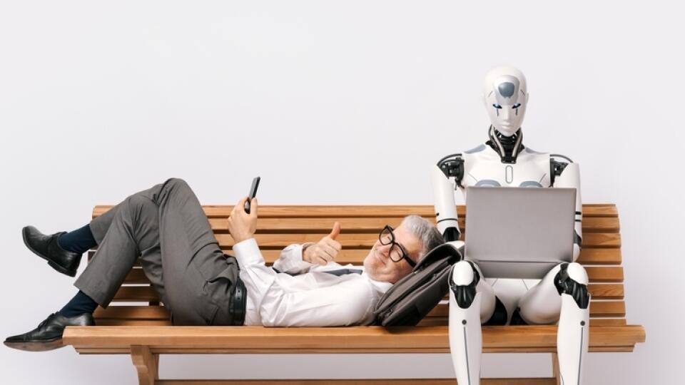 Happy,Businessman,Lying,On,A,Bench,And,Using,A,Smartphone