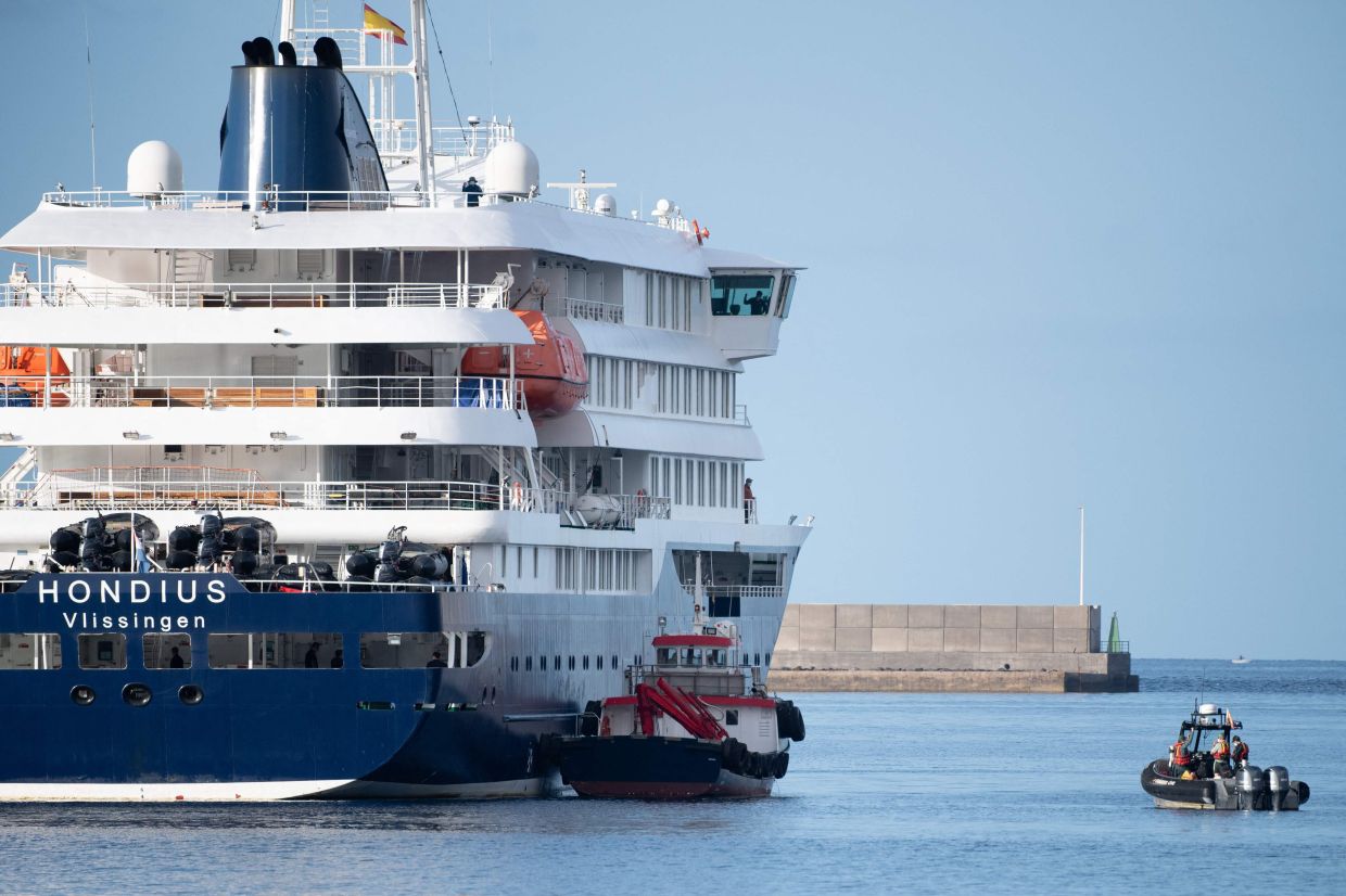 Passengers disembarking from hantavirus-stricken ship in Spain's Canary Islands