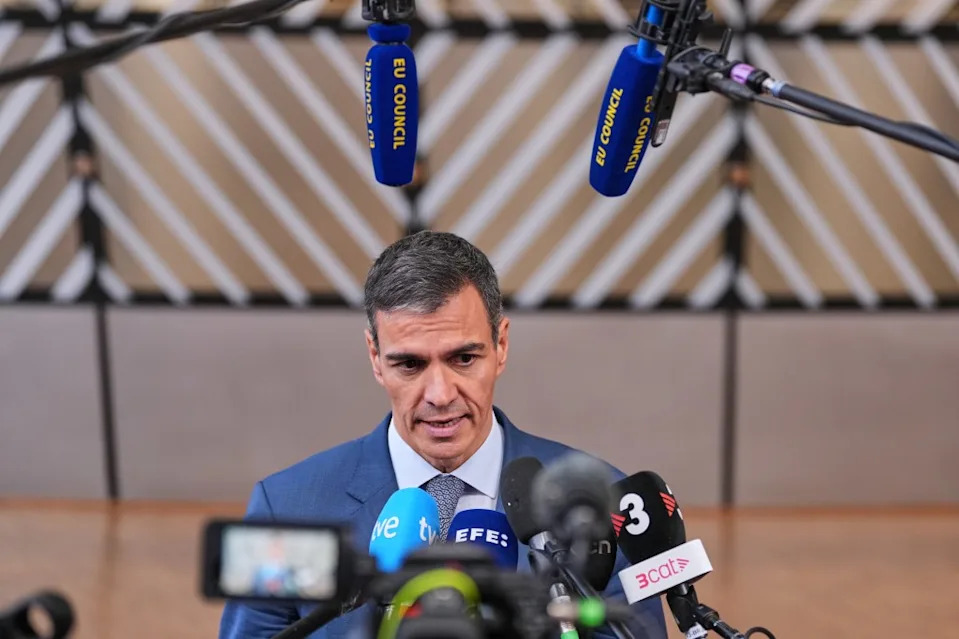 Spain’s Prime Minister Pedro Sanchez talks to journalists as he arrives for the EU summit in Brussels on June 18. (AP Photo/Marius Burgelman)