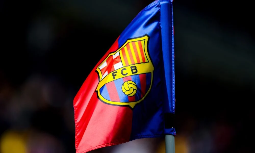 BARCELONA, SPAIN - FEBRUARY 02: A FC Barcelona badge sits on display in a corner flag during the LaLiga match between FC Barcelona and Deportivo Alaves at Estadi Olimpic Lluis Companys on February 02, 2025 in Barcelona, Spain. (Photo by David Ramos/Getty Images)