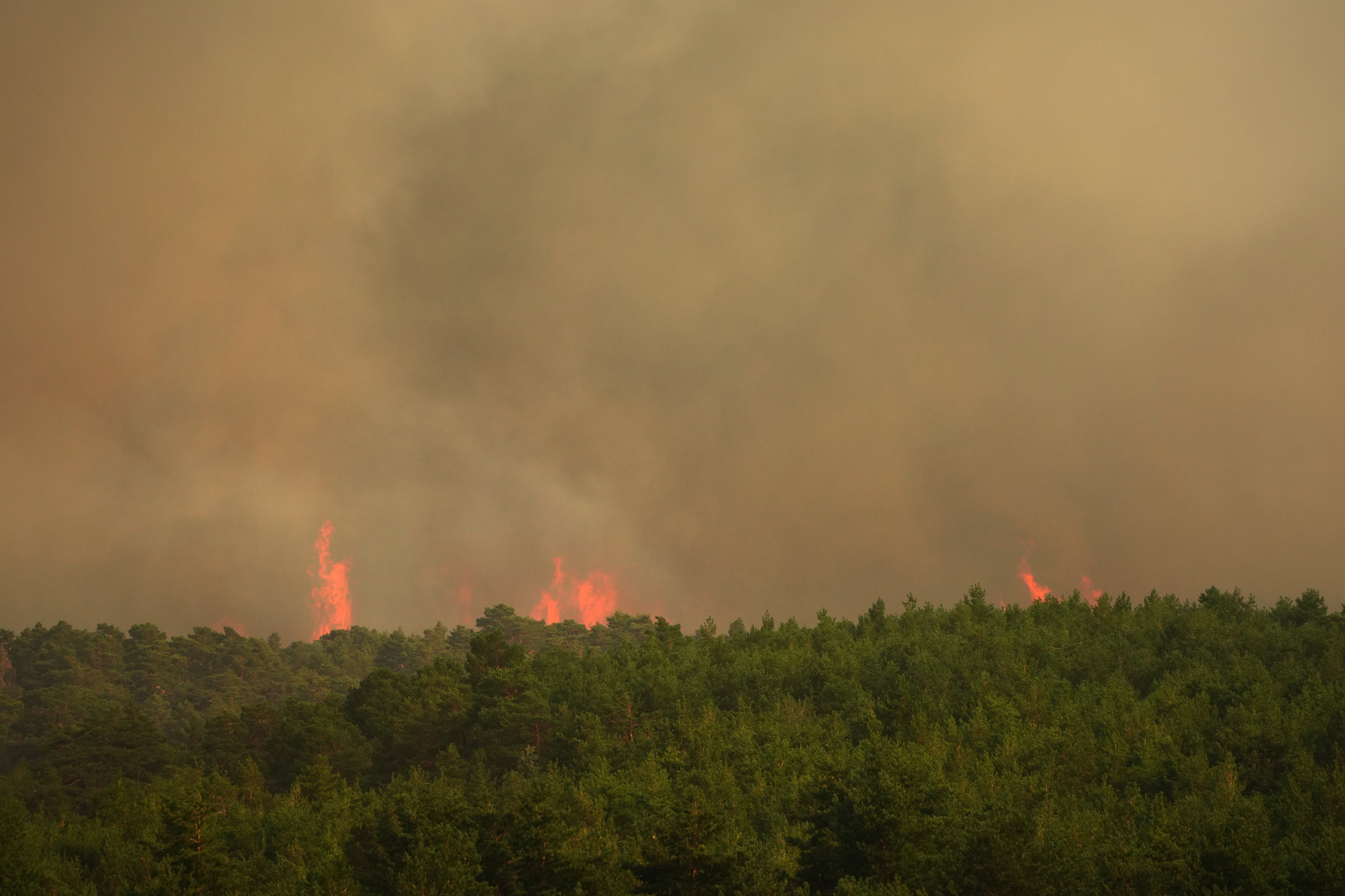 Wildfire advances near Condemios de Arriba, Guadalajara province, Spain, Wednesday, July 22, 2026, after a wildfire scorched tens of thousands of hectares