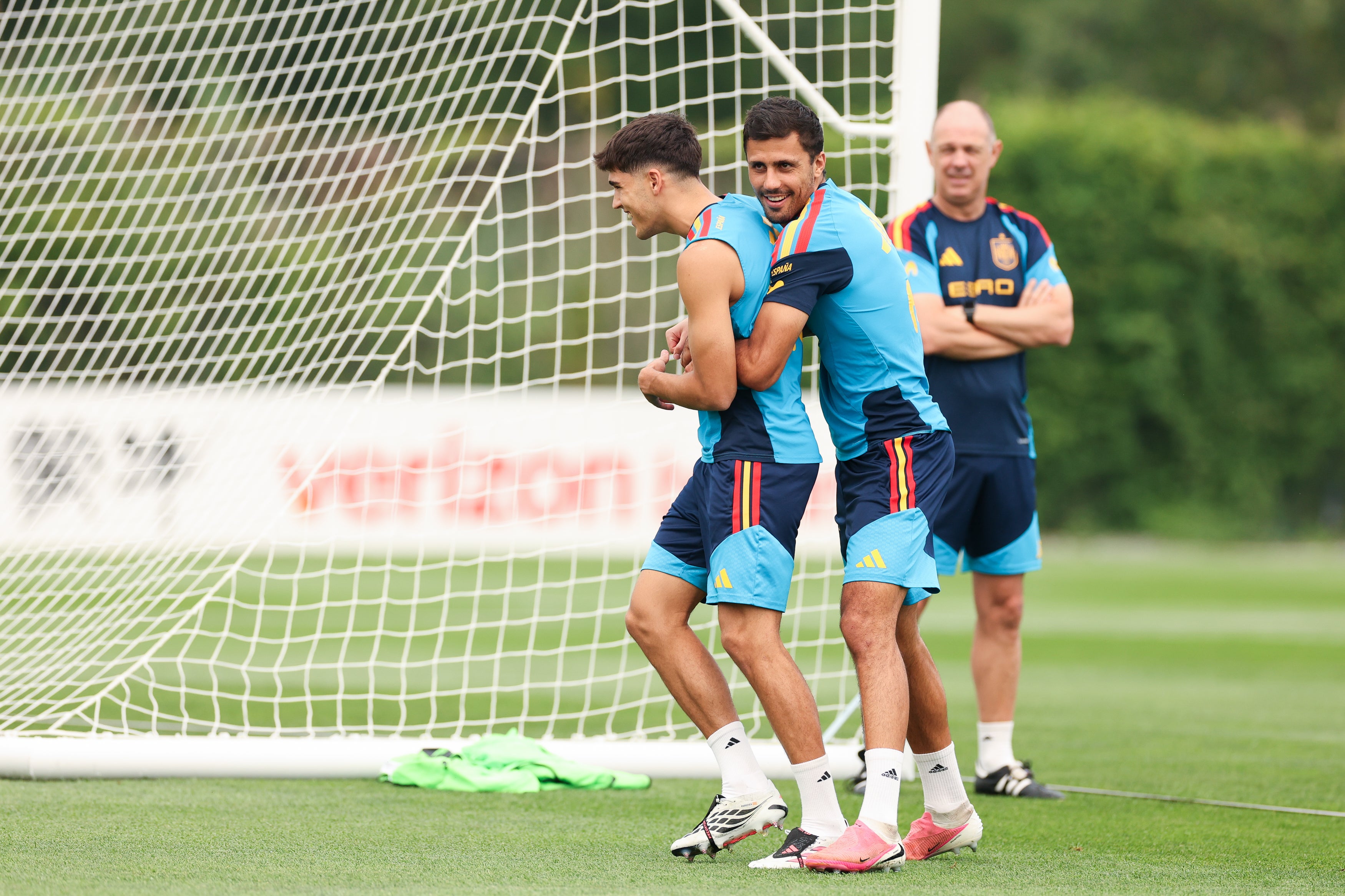 Rodri and Pau Cubarsi of Spain interact during the training session