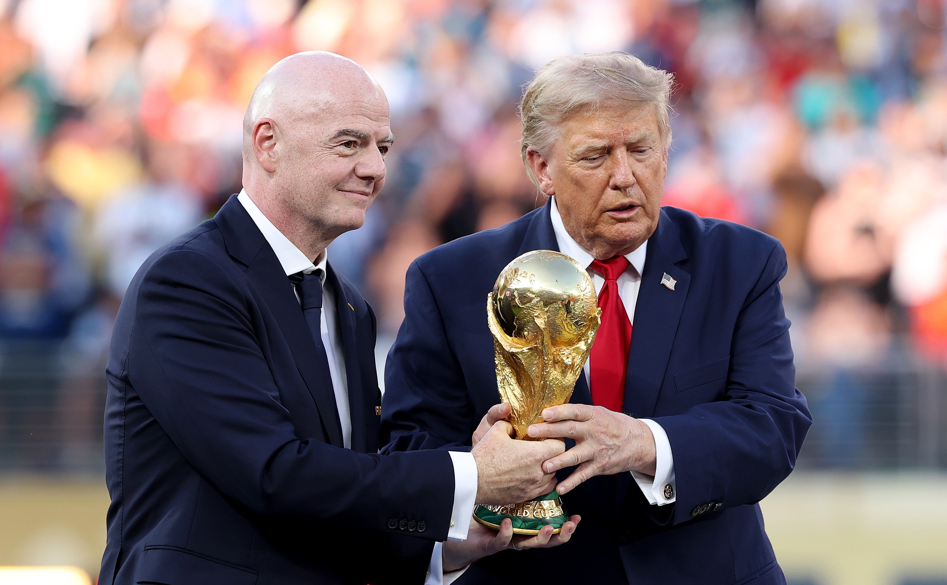 Trump handed over the World Cup trophy to the Spanish team alongside FIFA President Gianni Infantino on Sunday