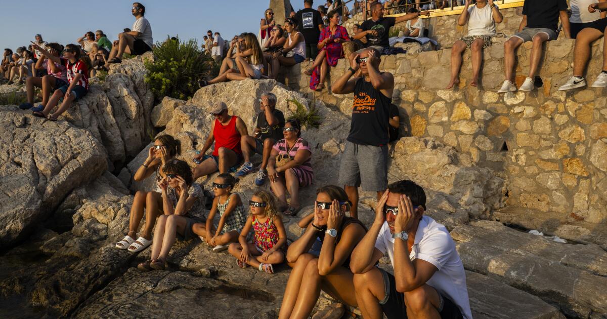 Millions crowd Spanish cities to see country's first total solar eclipse in over a century