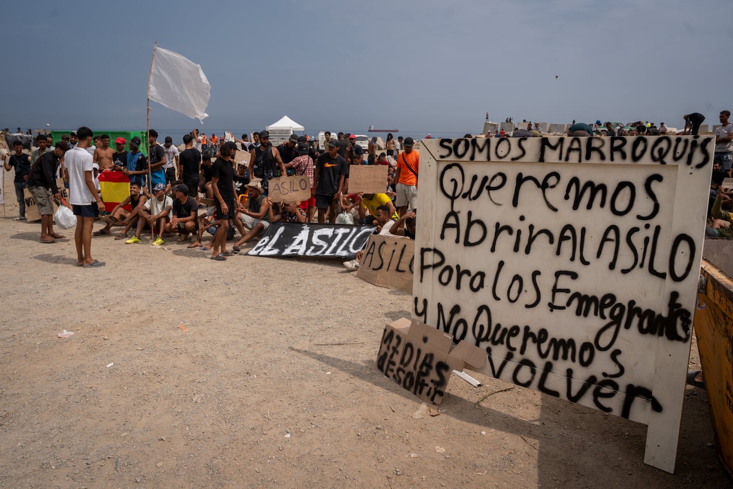 Migrants, mainly moroccan, gather in a protest asking for asylum in El Trampolin beach on Aug. 16, 2026 in Ceuta, Spain. Fears of a second surge of migrant crossings into the Spanish North African exclave of Ceuta have intensified following anonymous social media calls and false online rumours claiming that the border with Morocco will open. This follows the crisis in late-just where tens of thousands rushed the border due to misinformation surrounding a Spanish court ruling. One hundred deaths occurred as a result of 78,000 migrants crossing from neighbouring Morocco.