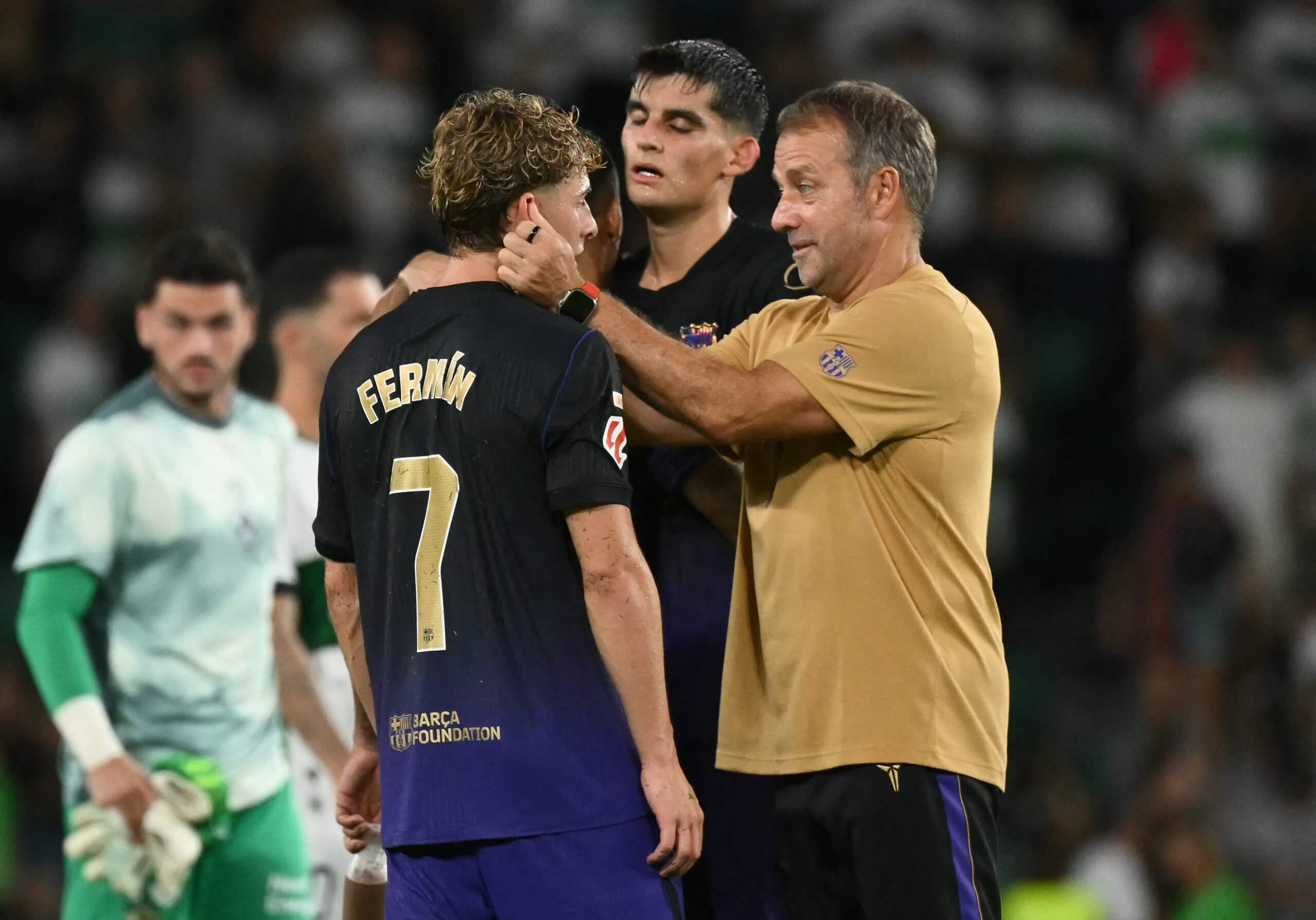 Hansi Flick embraces Fermin Lopez following Barcelona's 5-0 win at Elche on Sunday