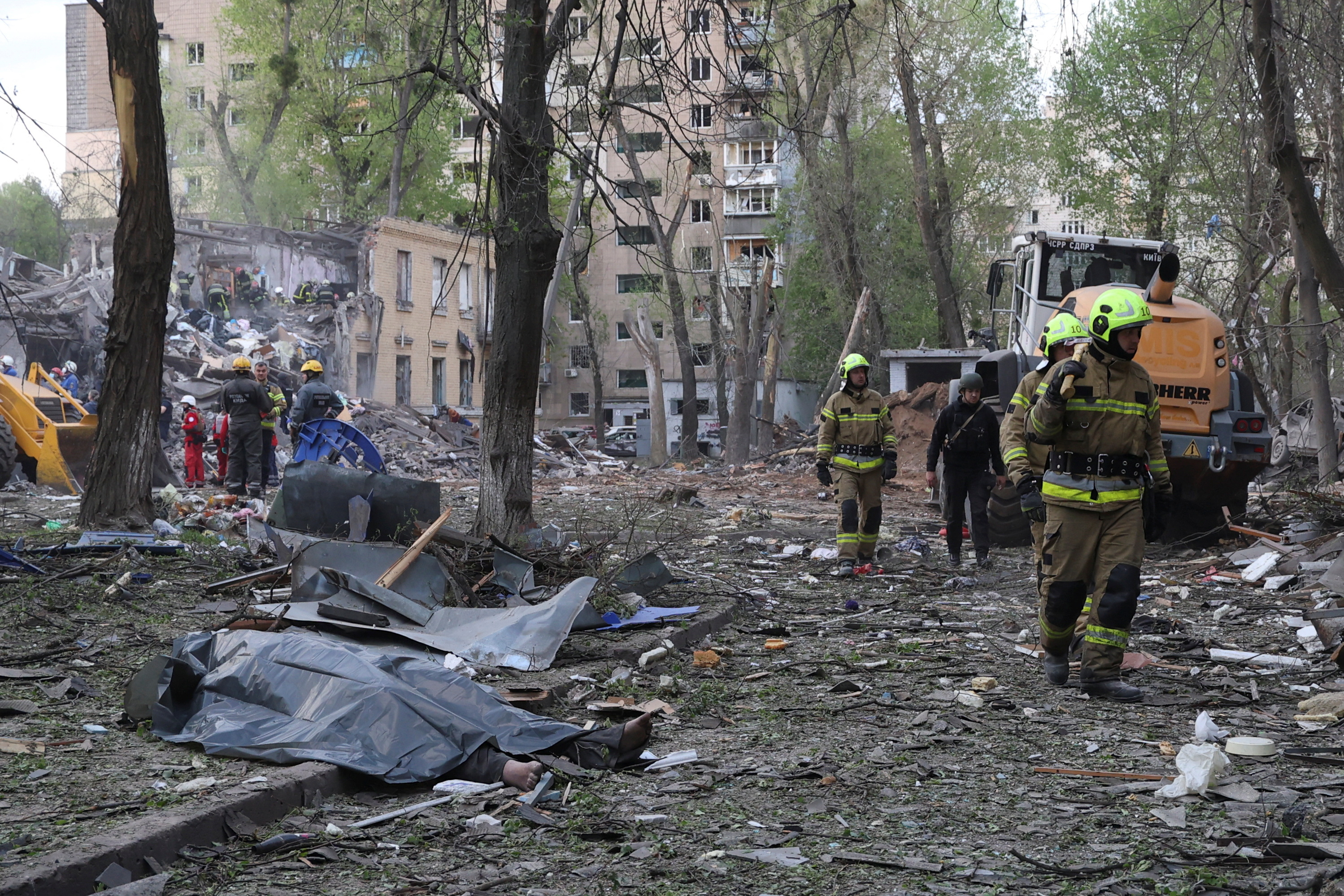Victims’ bodies are covered by sheeting