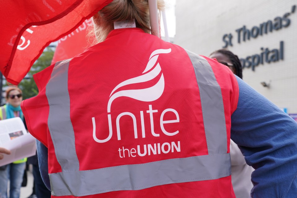Back of a Unite the Union member's safety vest.