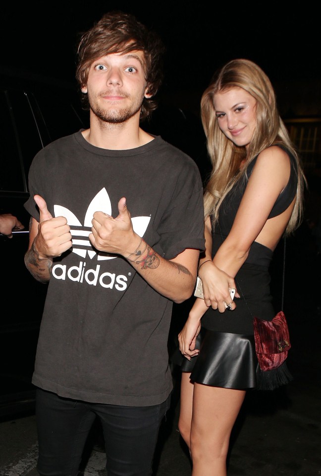 Louis Tomlinson and a blonde woman at a night out.