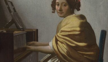 A lovely Vermeer painting of a young woman in a yellow shawl seated at a virginal.
