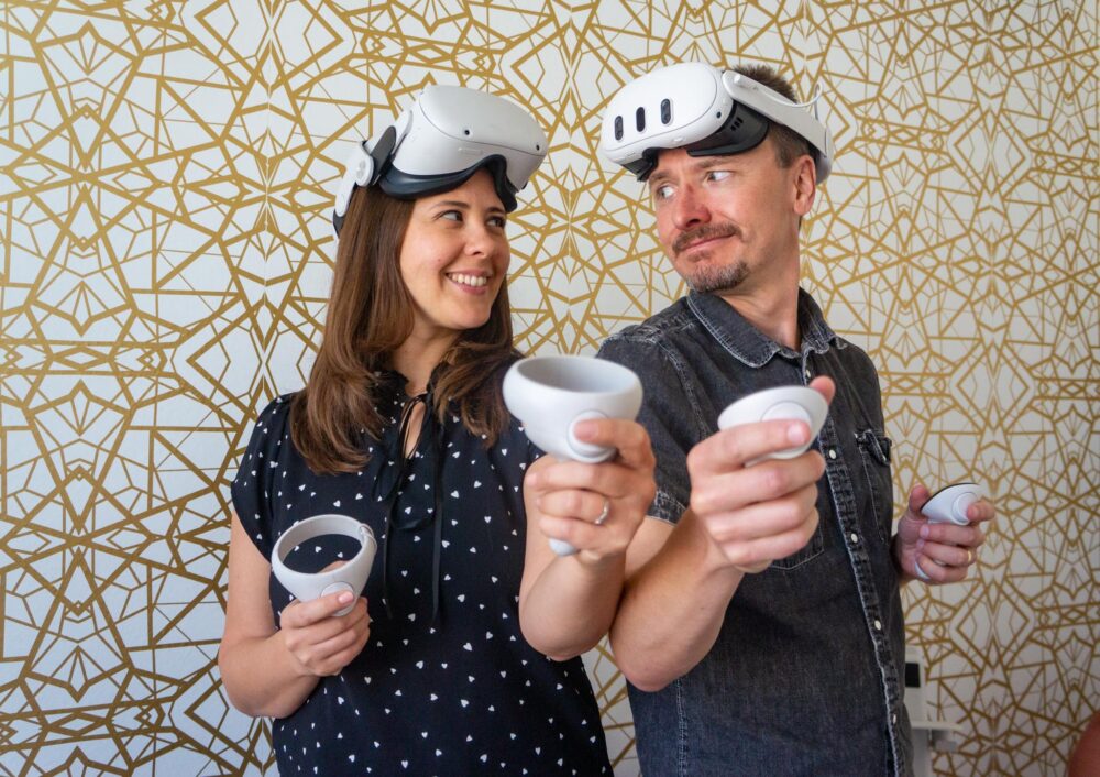 Julie Pifher Cawood and Michael Cawood wear their virtual reality Meta Quest gear needed to play their new VR game set to release in the upcoming weeks. April 9, 2025 Katherine Quezada/The Signal