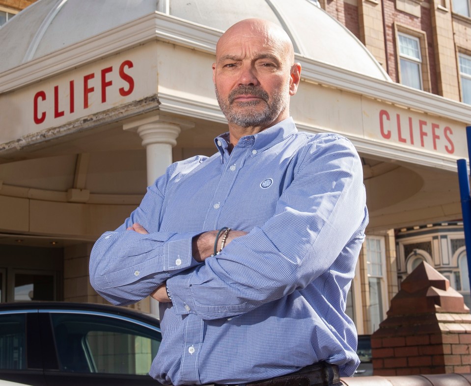 Eddie Nelder, Blackpool hotelier, stands in front of the Cliffs Hotel.