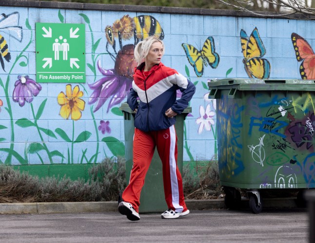 Lauren Bolton walking through the precinct looking worried in Coronation Street.