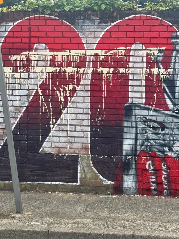 Vandalised mural outside The Sandon pub in Anfield