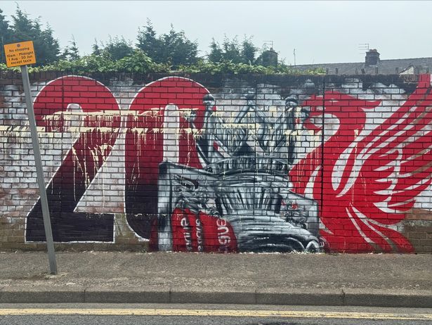 Vandalised mural outside The Sandon pub in Anfield