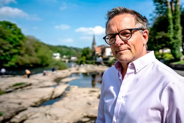 Michael Mosley in a pink shirt.