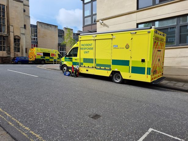 Ambulance vehicles responding to medical emergency.