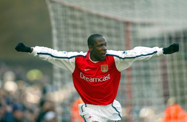 Lauren celebrates for Arsenal in 2002