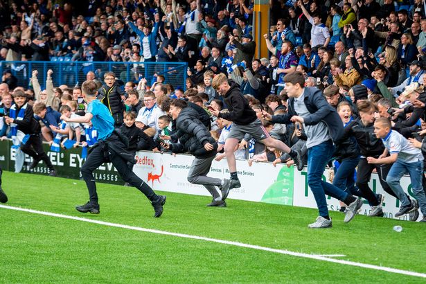 Fans stormed the pitch as soon as the final whistle sounded. 