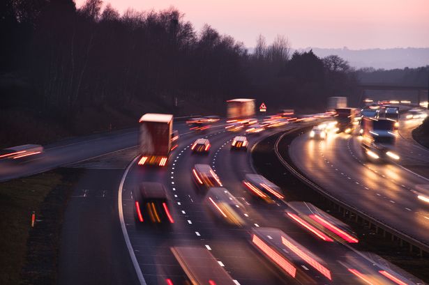 Busy traffic at dusk on the M42 motorway near Junction 3, at the A435, just south of Birmingham
