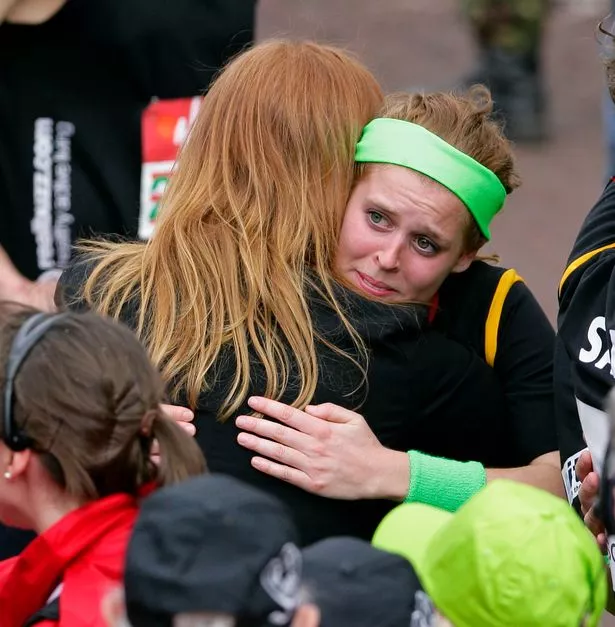 Beatrice gives her mum Sarah Ferguson a big hug after completing the race