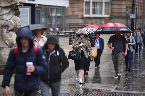 Covering up from the rain in the city centre