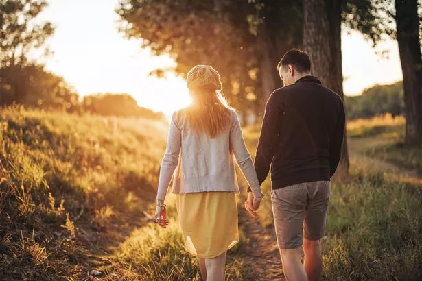 Couple walking hand in hand