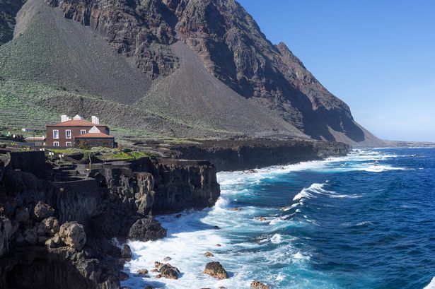 View over the coastline in Pozo de la Salud at the end of the El Golfo Valley showing rockface and sea