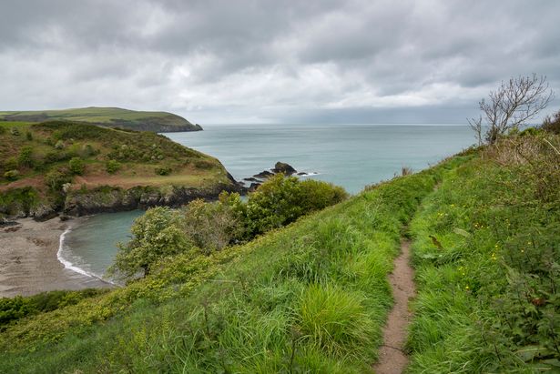 View from the coast path down on the beach at Aberfforest