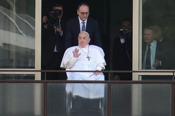 Pope Francis appears on his balcony to speak to the crowds at the Gemelli hospital, the first time he has appeared in public since being admitted to hospital on March 23, 2025 in Rome, Italy