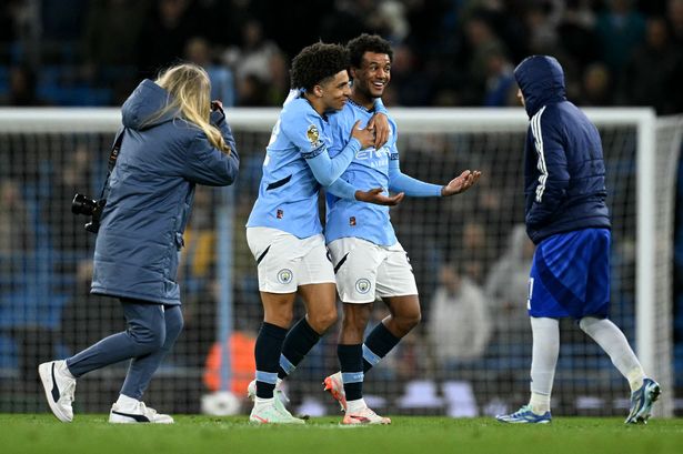 Manchester City's English defender #82 Rico Lewis (2L) and Manchester City's Norwegian midfielder #52 Oscar Bobb (2R) react following the English Premier League football match between Manchester City and Leicester City at the Etihad Stadium in Manchester, north west England, on April 2, 2025. (Photo by Oli SCARFF / AFP) / RESTRICTED TO EDITORIAL USE. No use with unauthorized audio, video, data, fixture lists, club/league logos or 'live' services. Online in-match use limited to 120 images. An additional 40 images may be used in extra time. No video emulation. Social media in-match use limited to 120 images. An additional 40 images may be used in extra time. No use in betting publications, games or single club/league/player publications. /  (Photo by OLI SCARFF/AFP via Getty Images)     