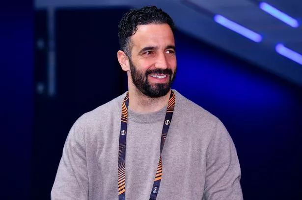 Manchester United head coach Ruben Amorim smiles.