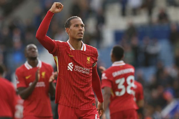 Liverpool captain Virgil van Dijk celebrates on the pitch after the English Premier League football match between Leicester City and Liverpool at King Power Stadium in Leicester, central England on April 20, 2025. Leicester were relegated from the Premier League after a 1-0 defeat to Liverpool. (Photo by Darren Staples / AFP) / RESTRICTED TO EDITORIAL USE. No use with unauthorized audio, video, data, fixture lists, club/league logos or 'live' services. Online in-match use limited to 120 images. An additional 40 images may be used in extra time. No video emulation. Social media in-match use limited to 120 images. An additional 40 images may be used in extra time. No use in betting publications, games or single club/league/player publications. /  (Photo by DARREN STAPLES/AFP via Getty Images)