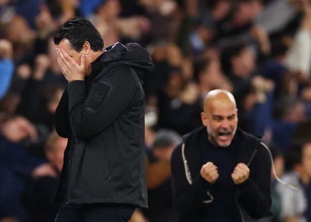 Unai Emery, Manager of Aston Villa, looks dejected as Pep Guardiola, Manager of Manchester City (obscured), celebrates 