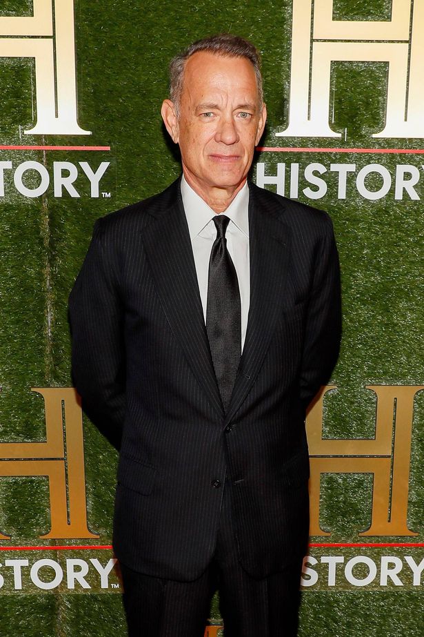 Tom Hanks attends HISTORYTalks 2022 on September 24, 2022 in Washington, DC wearing a black suit