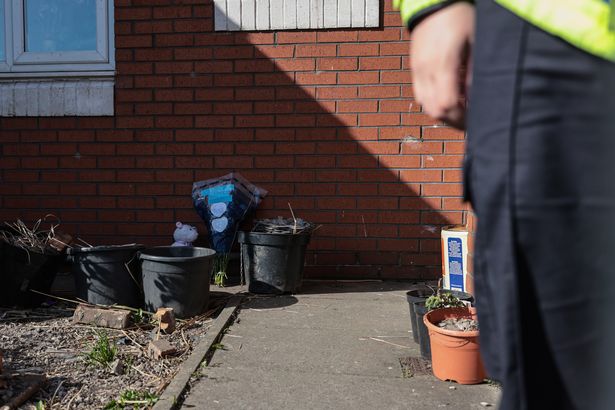 Flowers and a teddy left at the scene