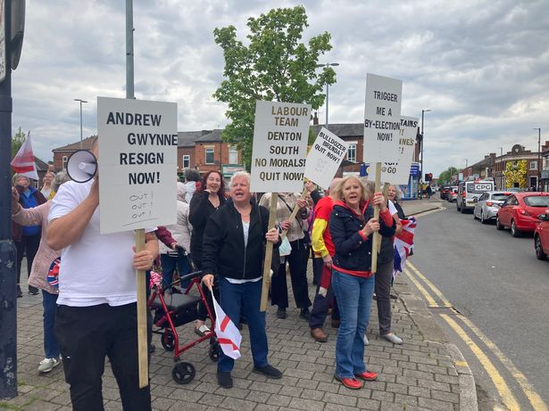 Protesters gathered at Jubilee Square in Denton calling on MP Andrew Gwynne to resign