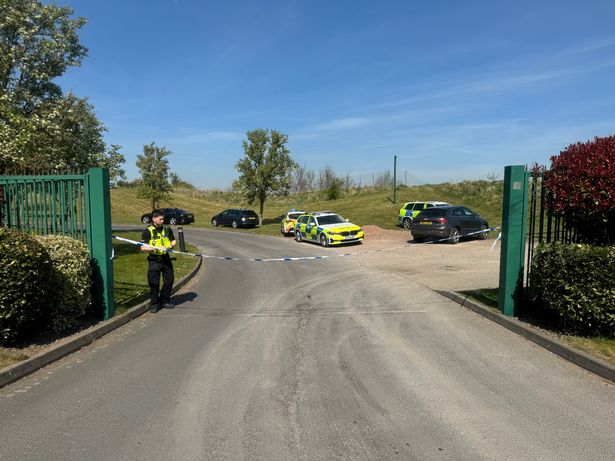 A police officer at the cordon at the entrance of Aston Wood Golf Club in Sutton Coldfield on the day a woman was hit by a van - and has now sadly died 