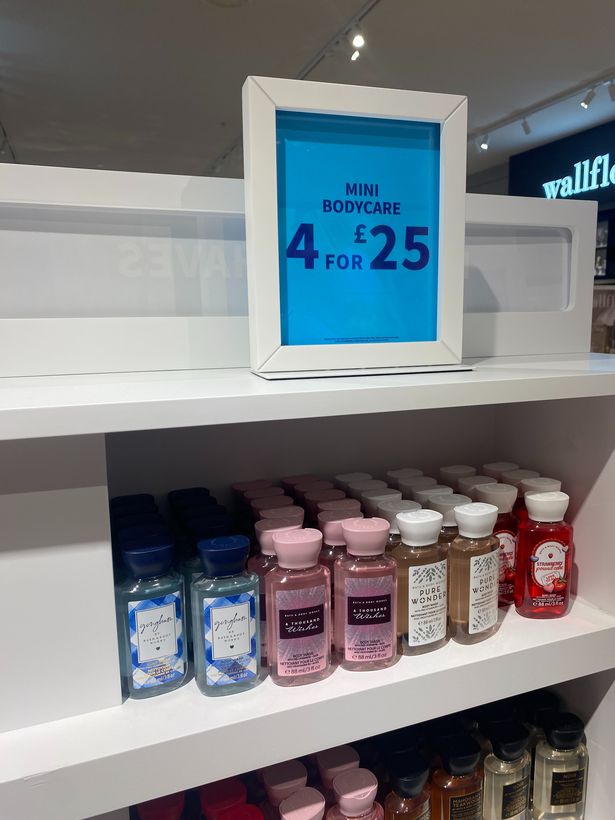 This photo shows body washes on a shelf. 