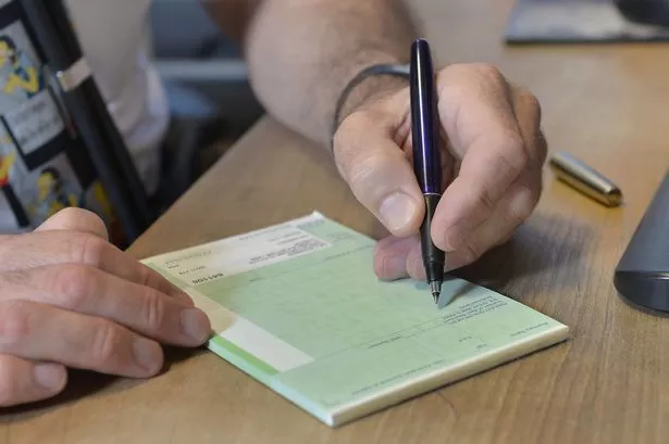 a GP writing a prescription