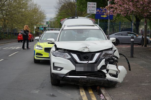 The damaged car at the scene