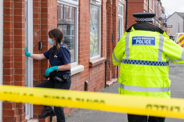 Police at the scene where chaos erupted from a house party in Salford