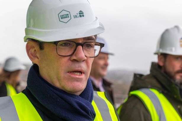 Greater Manchester mayor Andy Burnham in a hard hat and high-visibility jacket