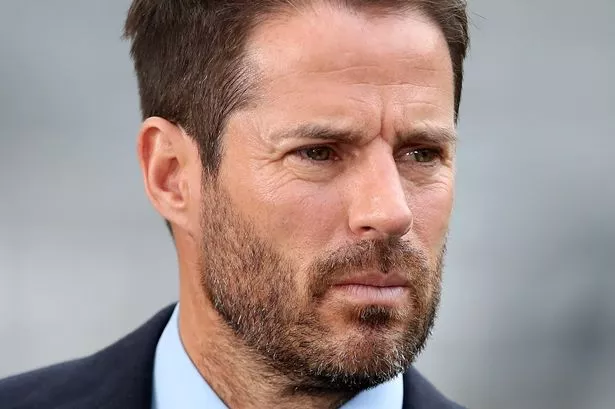 NEWCASTLE UPON TYNE, ENGLAND - OCTOBER 17: Jamie Redknapp of Sky Sports, wears a 'No Room For Racism' badge prior to the Premier League match between Newcastle United and Tottenham Hotspur at St. James Park on October 17, 2021 in Newcastle upon Tyne, England. (Photo by Ian MacNicol/Getty Images)