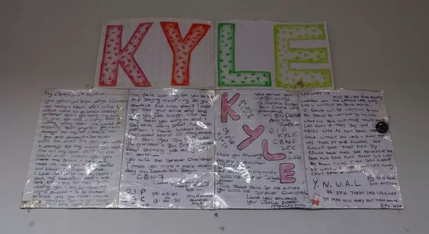 Handwritten notes from Kyle Whitley's family written to him following his death